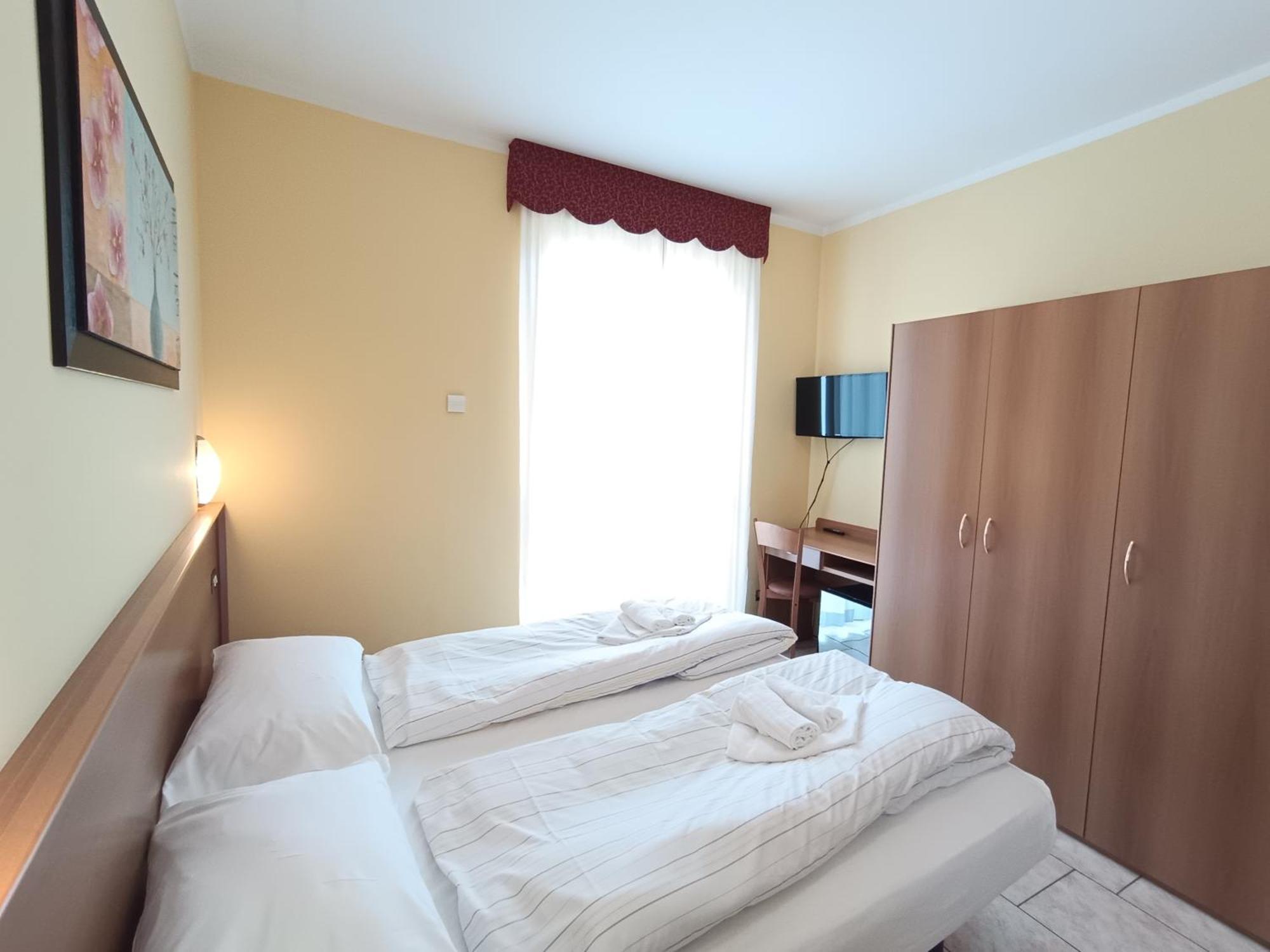 Dreibettzimmer mit Balkon